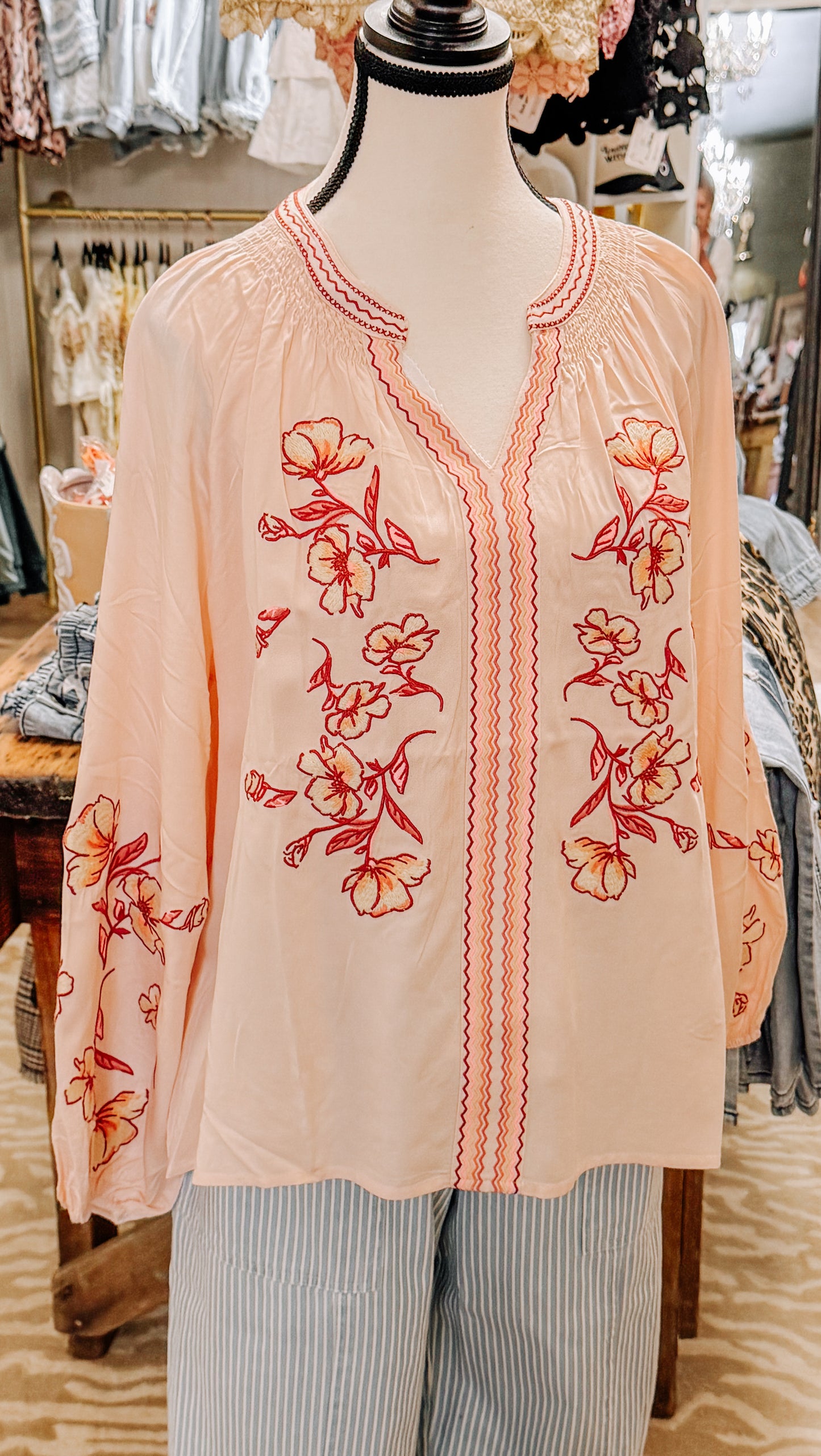 Peachy pink floral blouse.