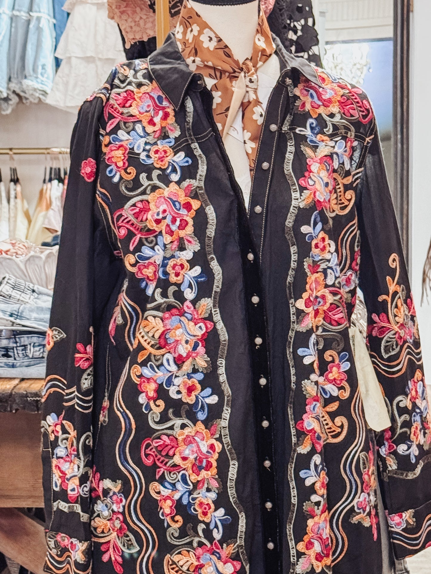Meadow of flowers embroidered black tunic by Aratta.