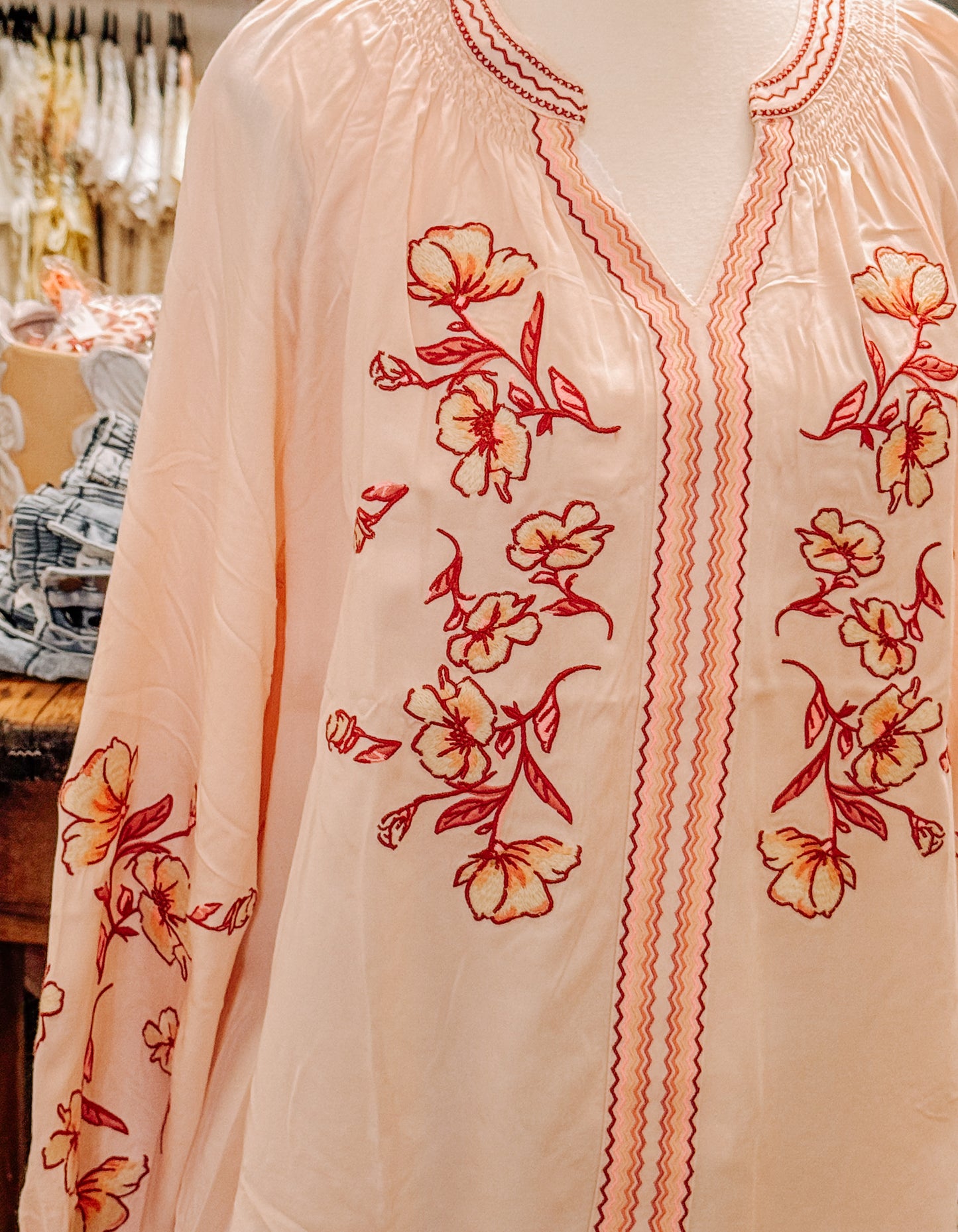 Peachy pink floral blouse.