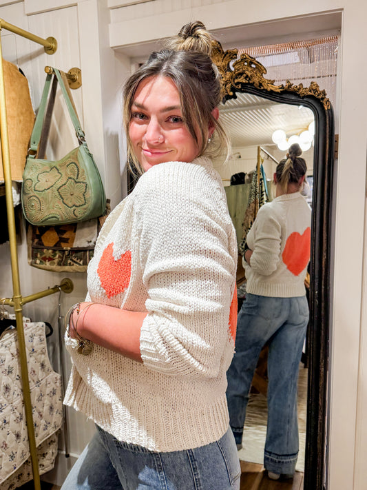 Collared heart V-neck pocket knit cardigan.